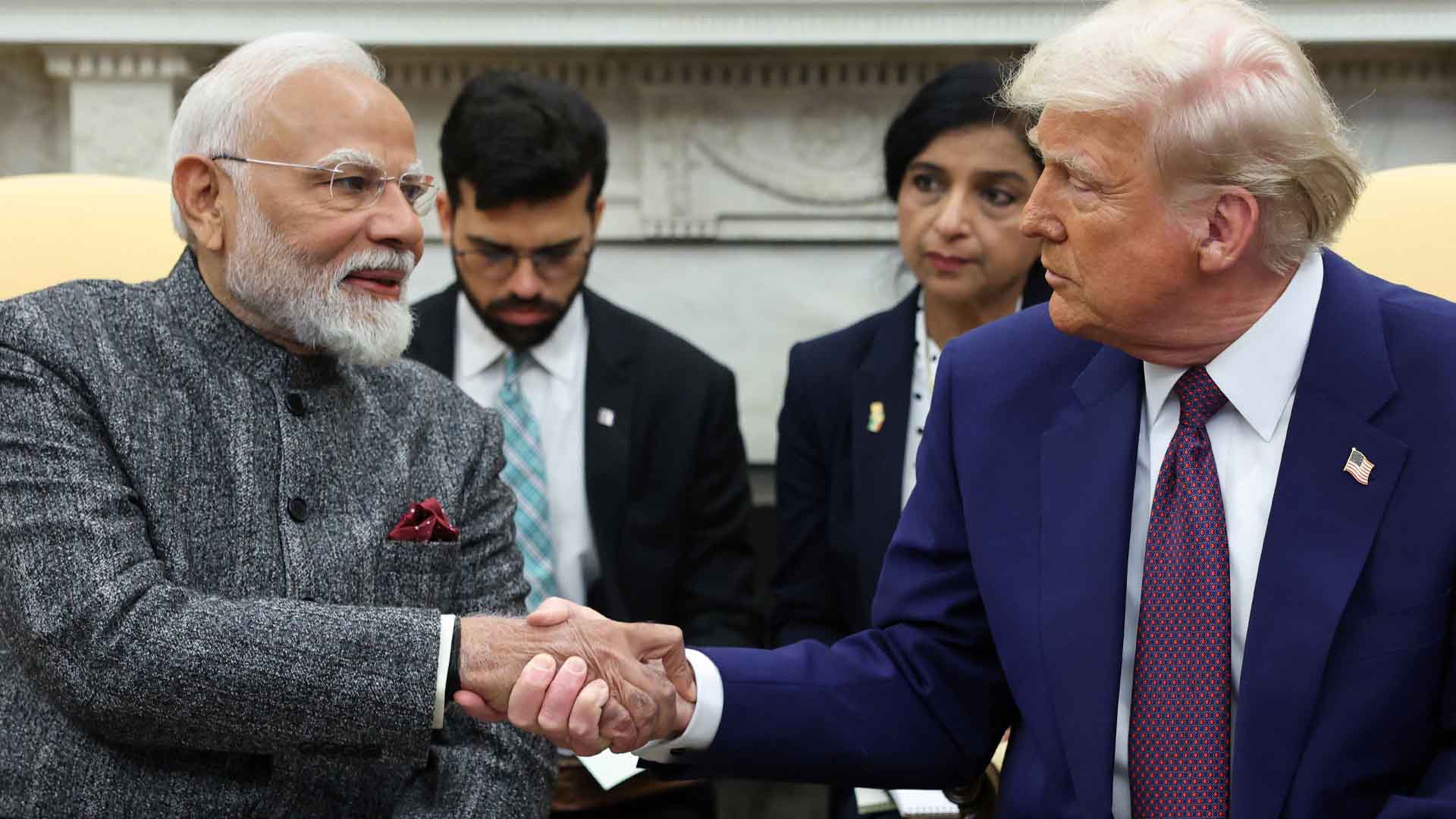 Leaders shaking hands in meeting TRUMP and Modi